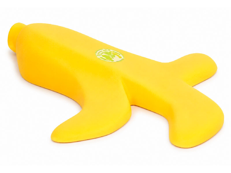 Sujetapuertas divertido de silicona con forma de platano amarillo chafado debajo de una puerta