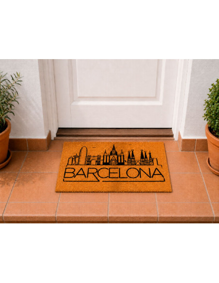 Felpudo de fibra de coco con el skyline de Barcelona y varios monumentos de la ciudad en la puerta de casa